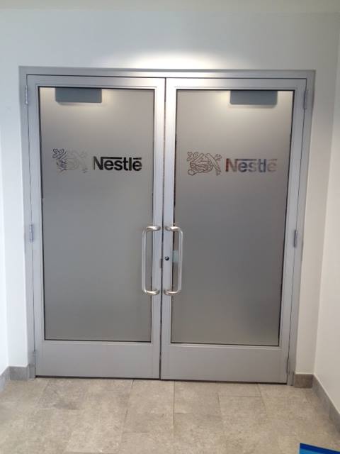 Nestle Frosted Glass Doors with Graphic Logo Cut Outs